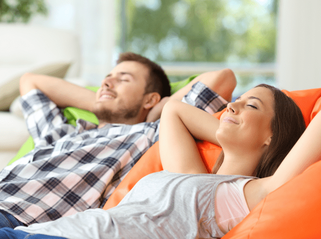 Couple smiling with eyes closed relaxing