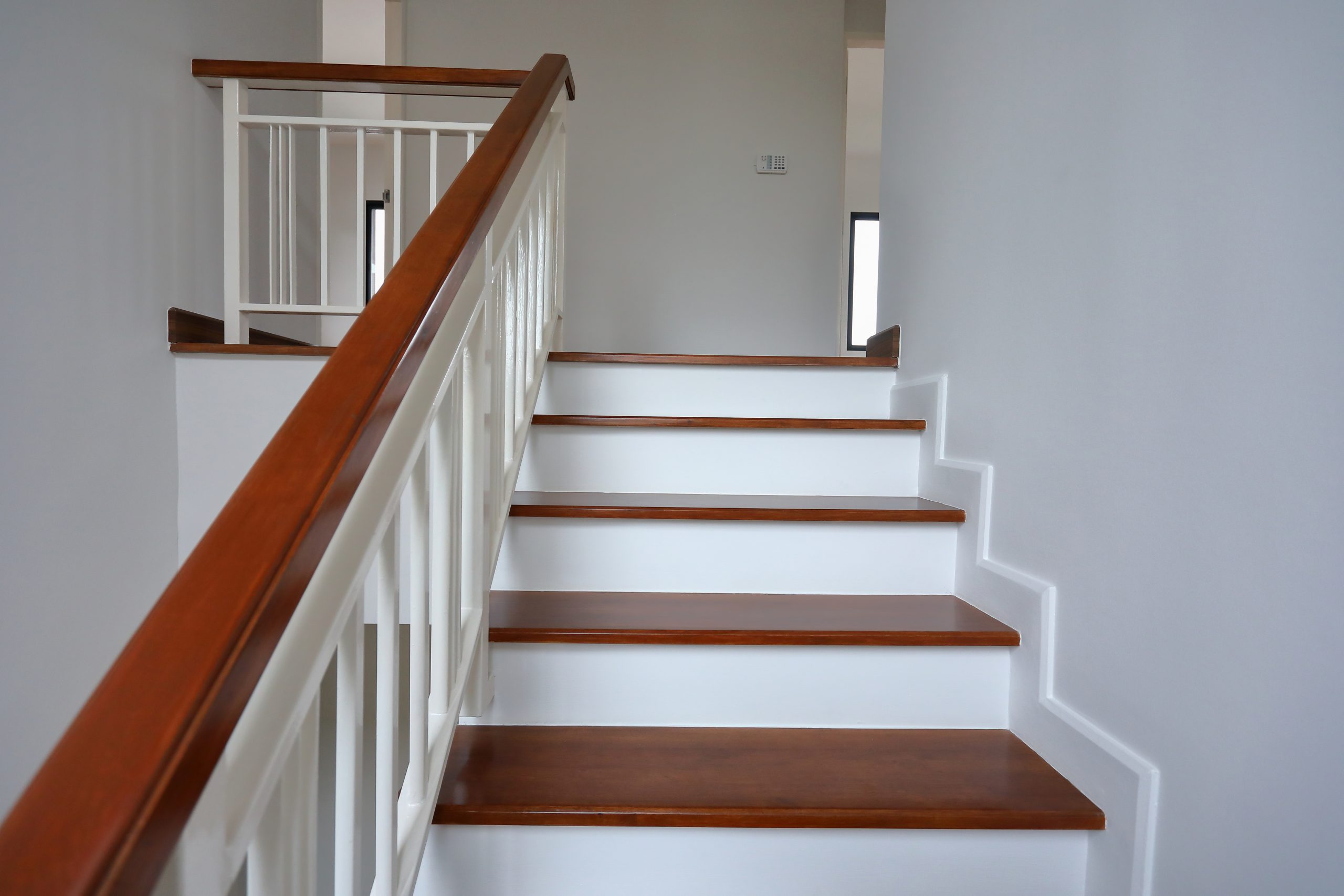 Wooden staircase leading to second floor of residential home