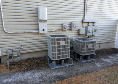 two new outdoor air conditioner condensers